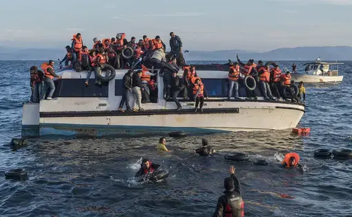Syrian and Iraqi refugees arrive on the island of Lesbos. Image by Georgios Giannopoulos. Greece, 2015. Courtesy Wiki Commons.