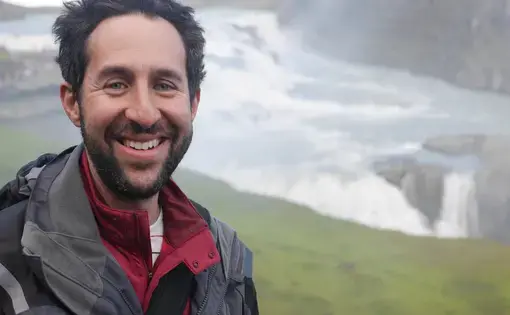 Eli Kintisch at Gullfoss waterfall in Iceland. Image by Lauren Weinstein. Iceland, 2016. Media file: p1130720.jpg