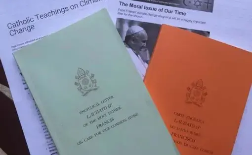 Printed version of the papal encyclical from the Vatican, offered in English and Portuguese. Image by Justin Catanoso. Peru, 2015. Media file: the_pope_and_the_environment_.jpg