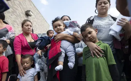About 25 immigrant mothers and their children caught coming across the Texas-Mexico border are released at the McAllen bus station wearing ankle monitors, on June 22, 2018. Image by Bob Daemmrich. Texas, 2018. About 25 immigrant mothers and their children caught coming across the Texas-Mexico border are released at the McAllen bus station wearing ankle monitors, on June 22, 2018. Image by Bob Daemmrich. Texas, 2018.