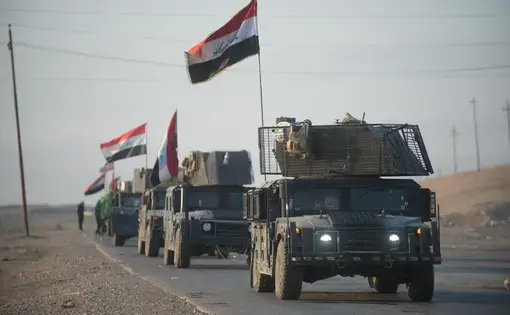 An Iraqi counterterrorism service convoy moves from Baghdad toward Mosul, Iraq, Feb. 23, 2017. Army photo by Staff Sgt. Alex Manne. Baghdad, 2017. (CC-0)(The appearance of U.S. Department of Defense (DoD) visual information does not imply or constitute DoD endorsement.)