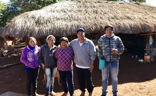 Cacique (chief) Ezequiel João Kaiowá (middle wearing a hat) and his family have waited since 2006 on the creation of an official Indigenous territory that will respects the historical boundaries of their village. Image by Rafael Lima. Brazil, 2019. 