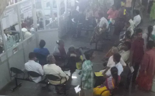 SVIMS Outpatient waiting area in front of "kendram" information hub. Image by Priya Ramchandra. India, 2015.