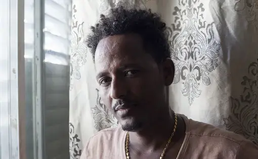 Mesgena (who chose to withhold his last name for privacy reasons), was an asylum seeker from Eritrea living with his wife and four small children in a one bedroom apartment in Tel Aviv. A victim of torture when crossing the Sinai to reach Israel, he was able to receive refugee status in Canada. He and his family were relocated to Toronto in late July. Image by Caron Creighton. Israel, 2018.