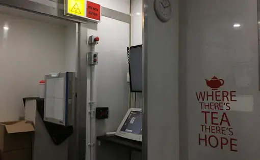 Inside the Find and Treat TB van, with the machine that x-rays patients and the computer that allows radiographers to instantly analyze scans. Image by Caitlin Bawn. England, 2017.