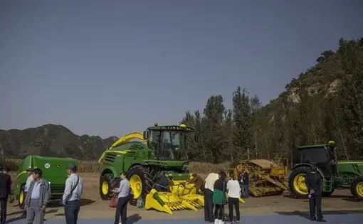 John Deere implements on display during the groundbreaking ceremony for the China-US Demonstration Farm on Saturday, Sept. 23, 2017, in Luanping County, Hebei, China. Image by Kelsey Kremer. China, 2017.