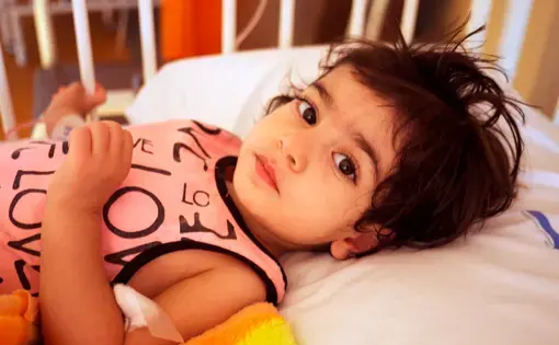 Ava, 2, had the holes in her heart mended during the first week of the medical mission. She was discharged from the ICU one day after surgery. Image by Farzana Shah. Iran, 2015. Media file: ava1.jpg