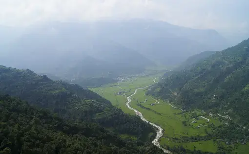 Giri Prasad B.K. hasn't been home to Baglung district, which includes lush, green river valleys, since he left Qatar for the second time in 2007. Giri Prasad B.K.'s wife and 9-year-old daughter live in their home in rural Baglung district, located west of Kathmandu. Image by Yam Kumari Kandel. Nepal, 2016.