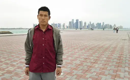 Tirtha Raj Tamang, a Nepalese migrant worker, says he was exploited by a Nepalese company that sent him to work in Qatar. He was photographed in Doha, Qatar's capital city. Image by Shilu Manandhar. Qatar, 2016.
