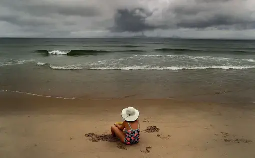 Salome Verkoville, 10 from Boston sits on Nauset Beach. Image by John Tlumacki. United States, 2019. Salome Verkoville, 10 from Boston sits on Nauset Beach. Image by John Tlumacki. United States, 2019.