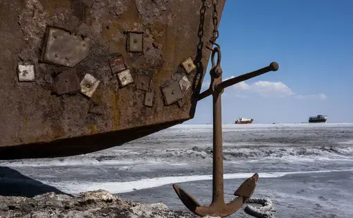 The remains of a large cargo ship marooned on the dried-out seabed of Lake Urmia. Image by Ako Salemi. Iran, 2016.