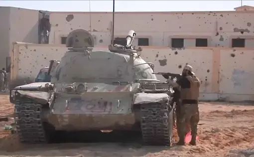 Libyan forces fight ISIS. Image by PBS NewsHour. Libya, 2018.