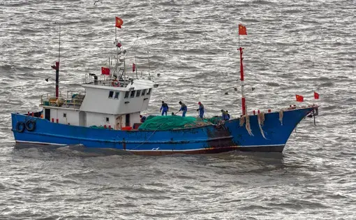 A commercial fishing boat on the South China Sea. Image by Igor Grochev / Shutterstock. 