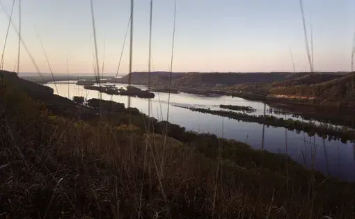 Trempealeau, Wisconsin - The Mississippi River. Agricultural fertilizer from 31 states wash into the Mississippi River. Like a topologic funnel it directs 41% of America’s water toward the delta, and America’s most productive fishing grounds. Image by Spike Johnson. United States, 2019. 