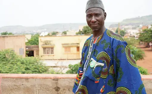Amadou Coulibaly outside his office at the Malian Association for Deportees in Bamako, Mali. Image by Sébastien Rieussec/Foreign Policy. Mali, 2017.