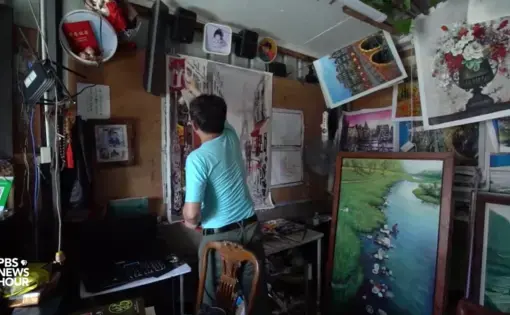 Artist Zeng Muquan has never set foot outside China, but he's painted tens of thousands of European scenes from his studio in the country's southern Guangdong province. Image by PBS NewsHour. China, 2019.