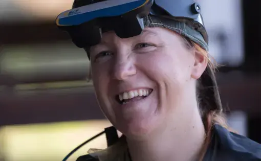 Veterinarian Lindley Reilly is shown at work at Gasser Farms LLC in Belgium. Reilly checked on the breeding and pregnancies of about 50 cows during her visit to the third-generation family farm. She is wearing a viewer for an ultrasound device. Image by Mark Hoffman. United States, 2019.
