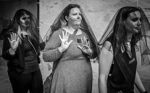 Women, many wearing black veils protesting the nomination of Brett Kavanaugh to the U.S. Supreme Court at the Hart Senate Office Building on Friday, September 7. Image by Phil Roeder. Washington D.C., 2018. (CC BY 2.0)