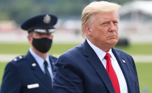 President Donald Trump walks to a limousine&nbsp;at Dobbins Air Reserve Base. Image by Evan El-Amin / Shutterstock. United States, 2020.