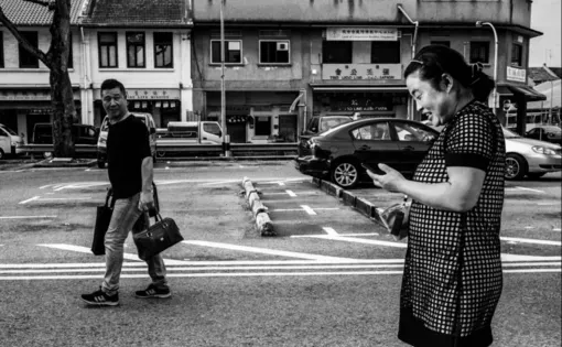 Mr. Cheng and Ms. Feng are on the way to the restaurant that offers free-meals to Chinese migrant workers.  Image by Xyza Bacani. Singapore, 2017.