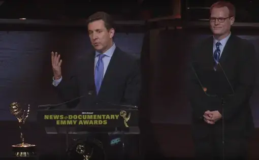 William Brangham (front) and Jason Kane (back) deliver the team's acceptance speech at the 38th Annual News and Documentary Emmy Awards.