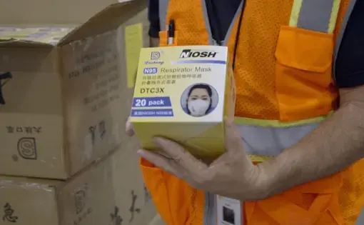 After a long delay, N95 masks are delivered to the United States from China. Image by PBS Frontline. United States, 2020.
