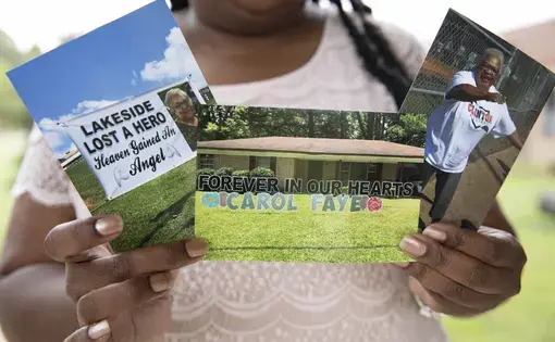 Shenika Jackson holds photos memorializing her late mother, Carol Faye Doby, who died from complications of COVID-19 earlier this year. Friday, September 25, 2020 in Bolton, MS. Image by Sarah Warnock/MCIR. United States, 2020.
