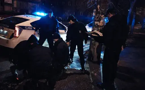 Lt. Maya Breslavski and her team detain a drunk driver after he attempted to flee the scene. Image by Misha Friedman. Ukraine, 2016.