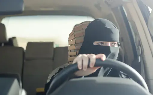 Woman driving in Saudi Arabia. Image by Shutterstock. Saudi Arabia, 2018.
