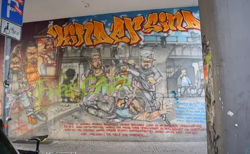A mural in Kreuzberg, the borough known as “Little Istanbul,” depicts the struggling youth culture of Berlin’s Turkish Community. The mural reads:
“Children follow our examples. Because of this, it’s our responsibility to educate them as to how to be positive role models for our entire community. Violence and egoism will only destroy that for which our parents have worked so hard to give us. We’ll create the world of tomorrow.” Image by Austin Davis. Germany, 2015. Image by Austin Davis. Germany, 2015.