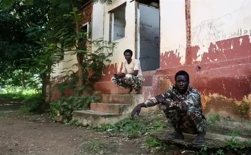 The FPRC in Ndele, Central African Republic, uses two crumbling buildings as the base for their soldiers. Image by Cassandra Vinograd. Central African Republic, 2017.