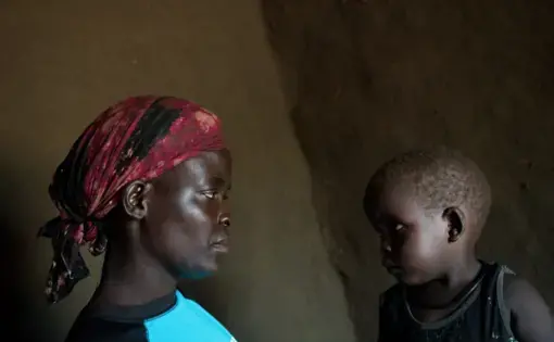 Lilias Diria with her son Abraham, age 2, in their home in the Bidi Bidi settlement in Uganda, June 25, 2019. Image by Adriane Ohanesian. Uganda, 2019.