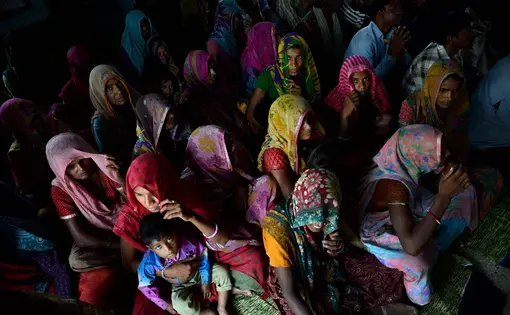 Residents of Tuvar gather in their schoolhouse to hear about the potential of bringing solar-powered electricity to the village. The village in rural northwestern India uses kerosene and firewood for energy. Image by Michael Henninger. India, 2016. powered electricity to the village. The village in rural northwestern India uses kerosene and firewood for energy. Image by Michael Henninger. India, 2016.