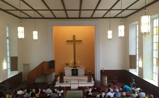 Visiting Trinity Church in Berlin one Sunday in July 2016. Half of the service was translated into Farsi. Image by Laura Kasinof. Germany, 2016.