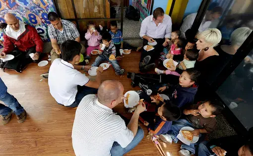 A visit to the Asociación Amigos del Niño Ayume orphanage in Bogota. Image by Tech. Sgt. Lesley Waters [CC BY 4.0]. Colombia, 2012.