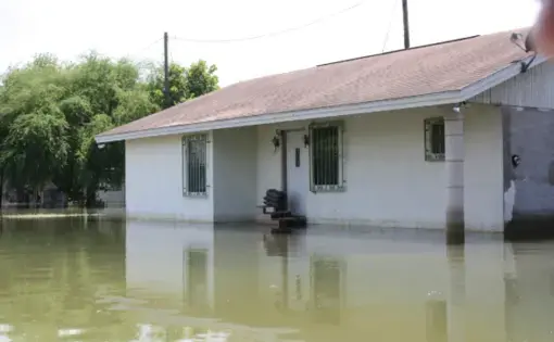 Rains from Hurricane Alex flooded streets in Roma, Texas, with more than 3 feet of water in July 2010. Roma is one of the communities along the Rio Grande where a border wall is to be built. Image by Daniel Llargues / FEMA. United States, 2010.