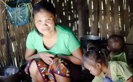 The mother of two boys who were killed by a 40-year-old American bomb in 2016.  Image by Erin McGoff. Laos, 2017.