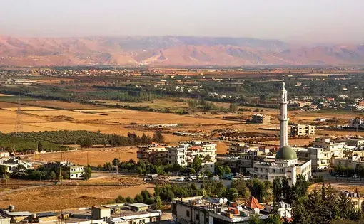 Lebanon's Bekaa Valley, only a few miles from the Syrian border, provides a range of growing conditions in which to test crops. Image by Jacob Russell. Lebanon, 2016.