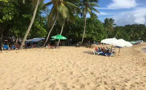 The main beach in Sosua, Dominican Republic. Women, facing few job prospects, travel to Sosua from across the island to find work in the sex industry. Locals say it’s common to see sex workers walking on the beach, looking for clients. Image by Emily Codik. Dominican Republic, 2017.