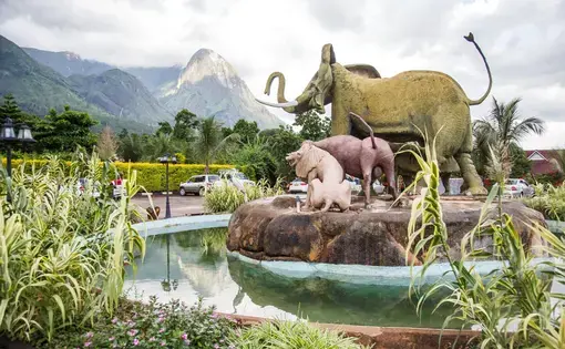 A statue of Africa’s ‘Big Five’ towers in front of the ‘Hapuwani Village Lodge’, a luxurious resort in Mulanje, in the south of Malawi. Image by Nathalie Bertrams. Malawi, 2017.
