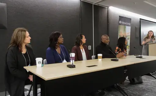 Pulitzer Center outreach coordinator Holly Piepenburg introduces the five panelists. From left to right: Time for Kids executive editor Jaime Joyce; Miami Herald correspondent Jacqueline Charles; digital video producer for National Geographic Gabrielle Ewing; senior investigative reporter for WGBH Phillip Martin; and multimedia reporter Melissa Noel. Image by Libby Moeller. United States, 2019.