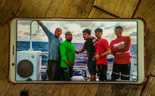 SEAFARERS. Jesus Gaboni (leftmost), with other Filipino crew aboard their fishing vessel. The man on the rightmost, Raul Calopez, got sick onboard and eventually died. Gaboni helped store Calopez's body in the ship's freezer. Image by Martin San Diego.