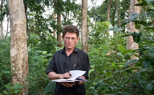 “We survived on hardships,” Abdul Mozid says of his childhood in Myanmar. He had to sell chickens and beg for food, and learned to read and write years later at a refugee camp in Bangladesh. Image by Sasha Ingber. Bangladesh, 2019.