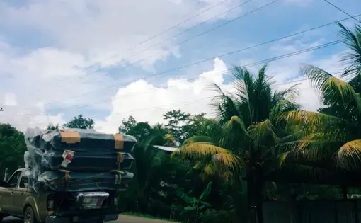 Freshly-assembled caskets on the highway from San Pedro Sula to Tegucigalpa. Image by Emily Gogolak. Honduras, 2015.