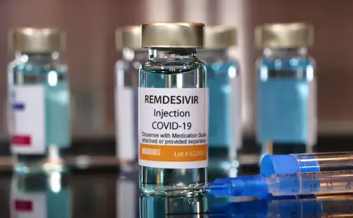 Vial of the drug remdesivir with syringe for COVID-19 treatment. Image by Bernard Chantal / Shutterstock. 2020.