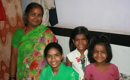 Rima Prajapati with daughters (from left) Jhoti, Aarti and Sangeeta. Jhoti and Aarti were both born deaf. Rima moved her daughters from their village to Mumbai so they could attend a school for the deaf. Image by Kate Petcosky-Kulkarni. India, 2016.