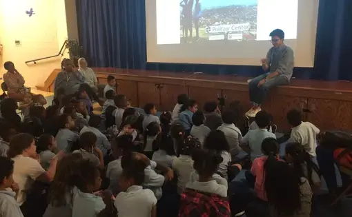 Austin Merrill discusses Everyday Africa with a group of first and second grade students at Takoma Education Campus. Image by Hannah Berk. United States, 2017.