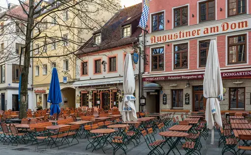 In March, Munich's restaurants and bars stood empty due to the initial coronavirus shutdown. Image by Jazzmany / Shutterstock. Germany, 2020,