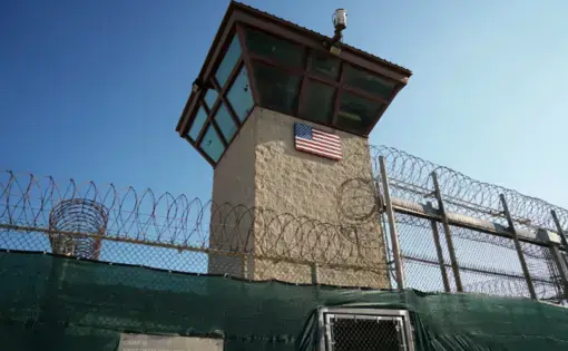 This photo, reviewed and approved by the U.S. military, shows a guard tower in the Detention Center Zone at Guantánamo Bay, Cuba. Image by Doug Mills / The New York Times. Cuba, 2019.