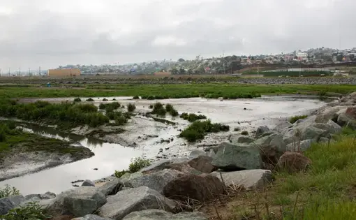 A tributary near the U.S.-Mexico border where sewage from Tijuana flows through. Image by Adriana Heldiz / Voice of San Diego. United States, undated.